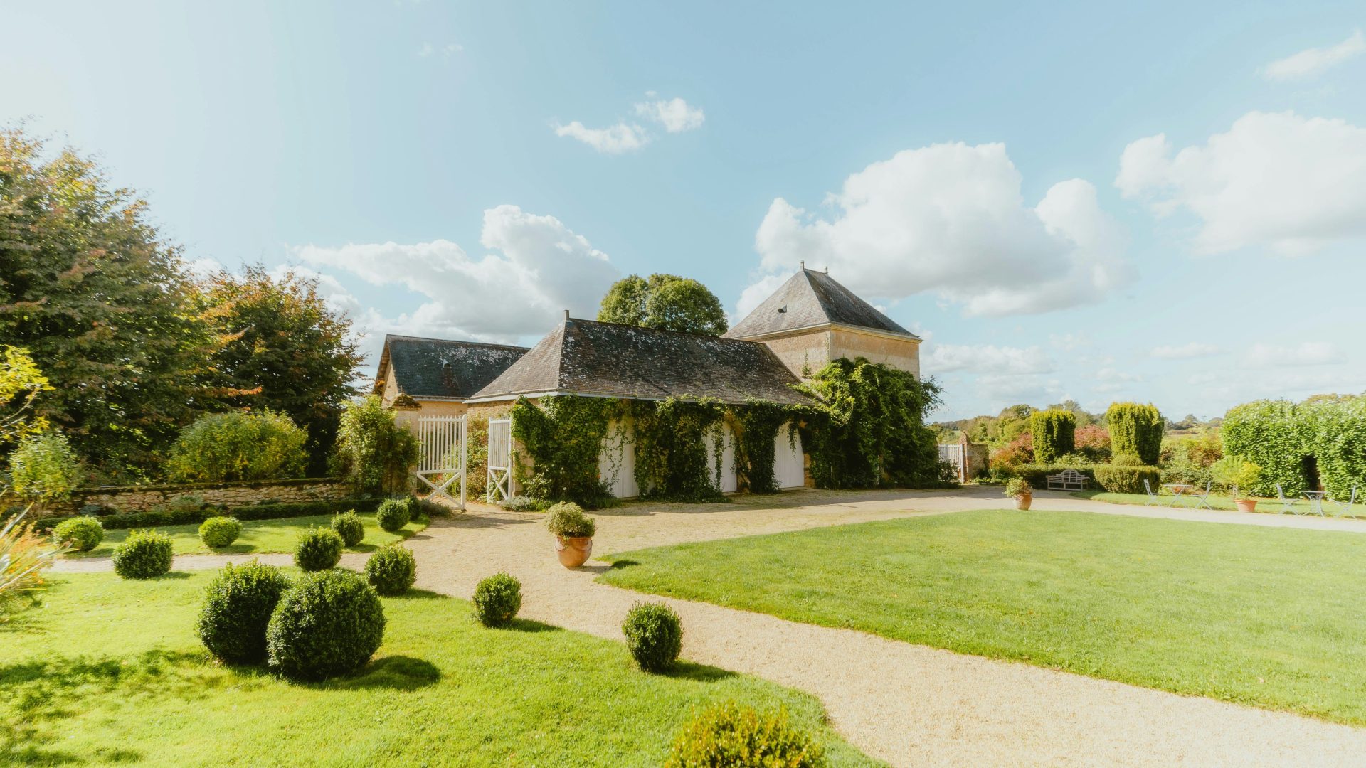 A large house with a driveway in front of it